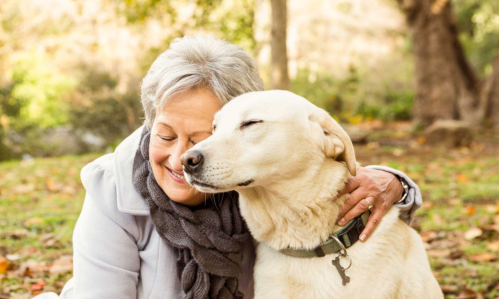 An older woman with her dog