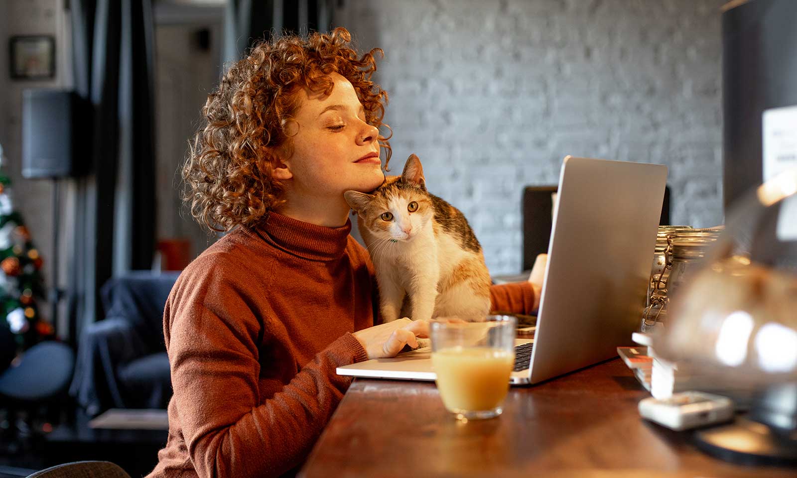 A woman with her cat looking up information