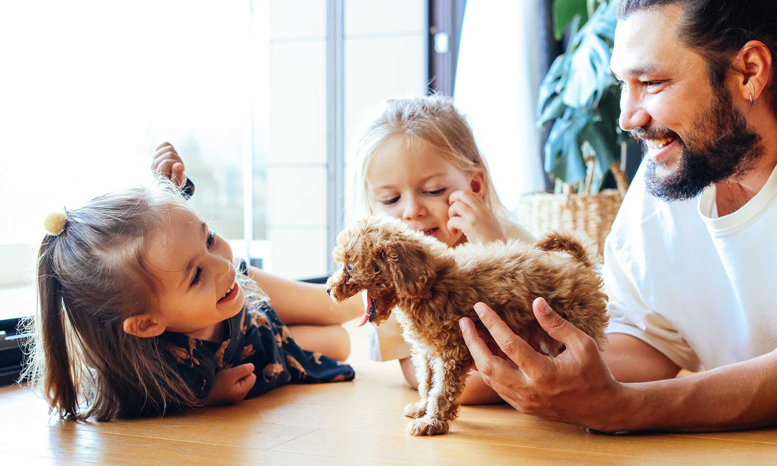 A family with a fluffy puppy